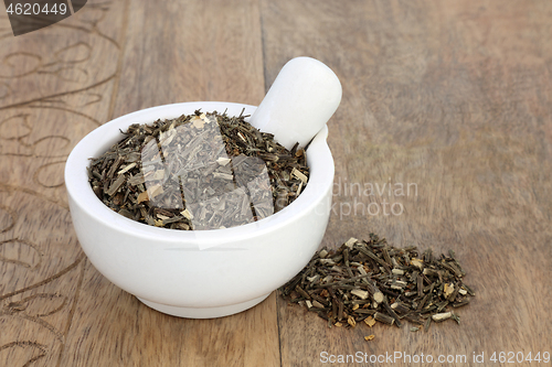 Image of Broom Herb in a Mortar with Pestle