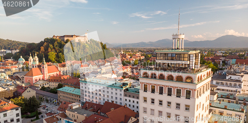 Image of Cityscape of Ljubljana, capital of Slovenia, and it\'s old skyscraper in warm afternoon sun.