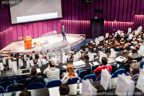 Image of Speaker giving presentation on business conference event.