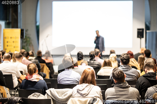 Image of Business speaker giving a talk at business conference event.