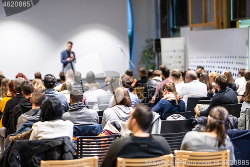 Image of Business speaker giving a talk at business conference event.