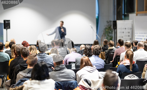 Image of Business speaker giving a talk at business conference event.