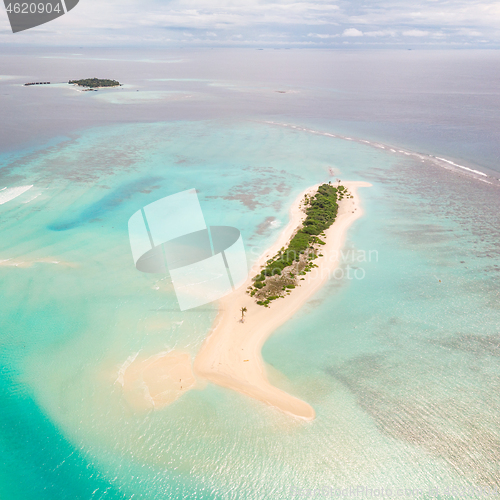 Image of Picture perfect beach and turquoise lagoon on small tropical island on Maldives