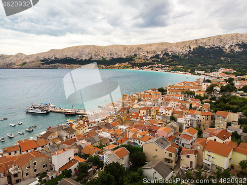 Image of Aerial panoramic view of Baska town, popular touristic destination on island Krk, Croatia, Europe.