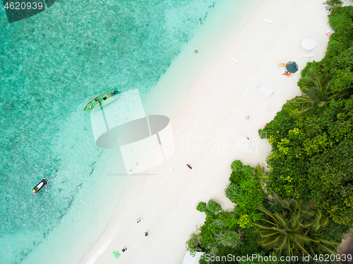 Image of Aerial drone view of picture perfect beach and turquoise lagoon on small tropical island on Maldives