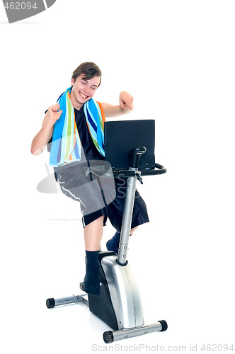 Image of Young boy doing fitness and studying