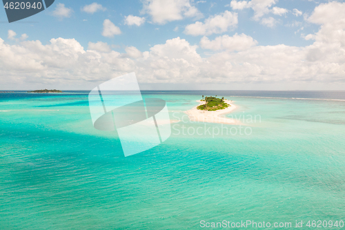 Image of Picture perfect beach and turquoise lagoon on small tropical island on Maldives