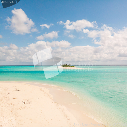 Image of Picture perfect beach and turquoise lagoon on small tropical island on Maldives