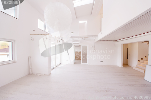 Image of Interior of empty stylish modern open space two level apartment