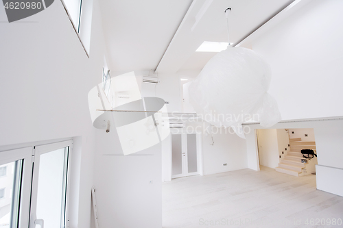 Image of Interior of empty stylish modern open space two level apartment