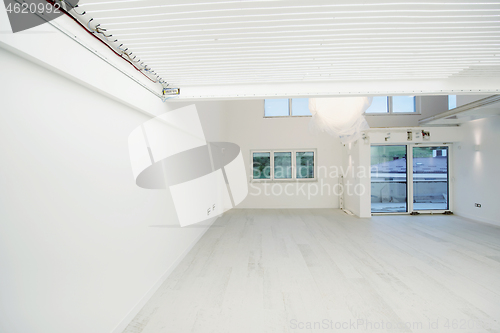 Image of Interior of empty stylish modern open space two level apartment