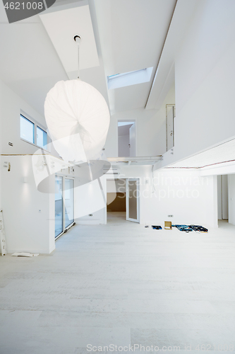 Image of Interior of empty stylish modern open space two level apartment