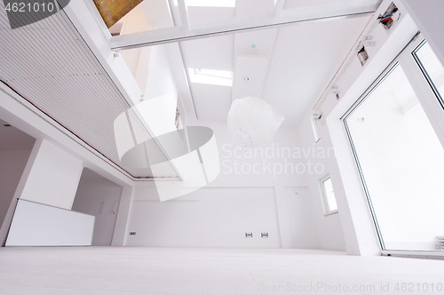 Image of Interior of empty stylish modern open space two level apartment