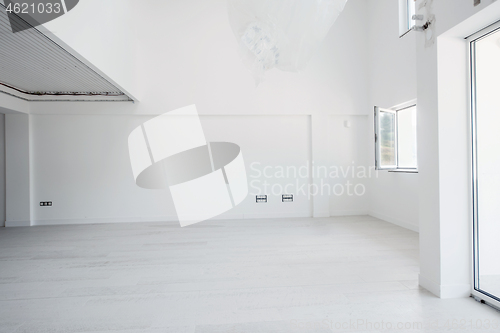 Image of Interior of empty stylish modern open space two level apartment