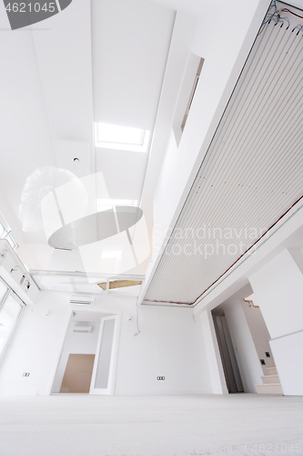 Image of Interior of empty stylish modern open space two level apartment