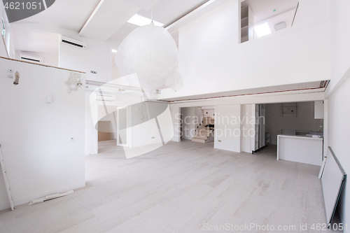 Image of Interior of empty stylish modern open space two level apartment