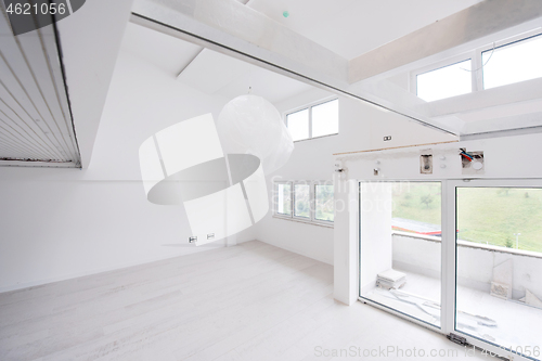 Image of Interior of empty stylish modern open space two level apartment