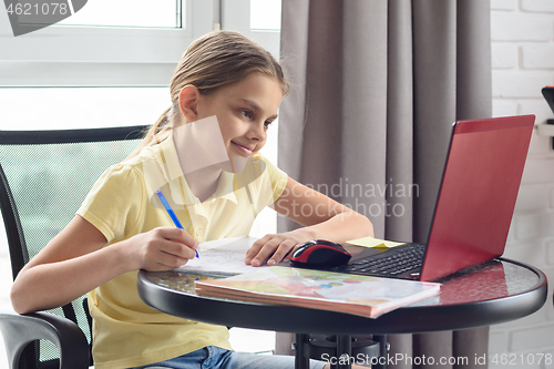 Image of Girl enjoys doing online lessons