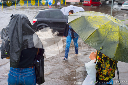 Image of People in flooded rainy city