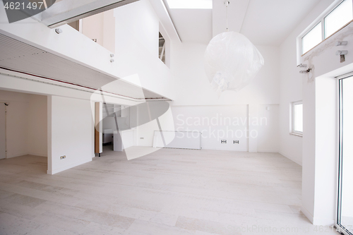 Image of Interior of empty stylish modern open space two level apartment