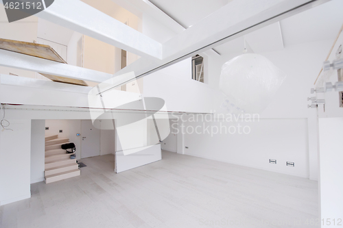 Image of Interior of empty stylish modern open space two level apartment