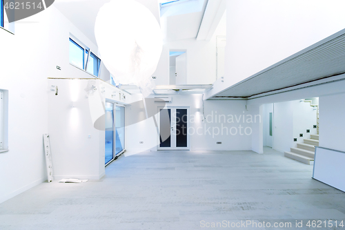 Image of Interior of empty stylish modern open space two level apartment