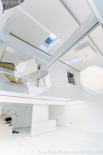 Image of Interior of empty stylish modern open space two level apartment