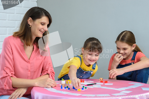 Image of Girl makes another move playing a board game