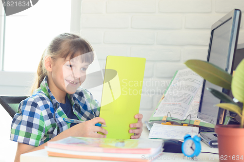 Image of The girl communicates using online services with friends