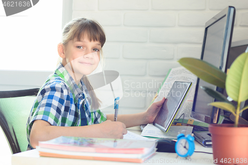 Image of Girl does homework with a online services
