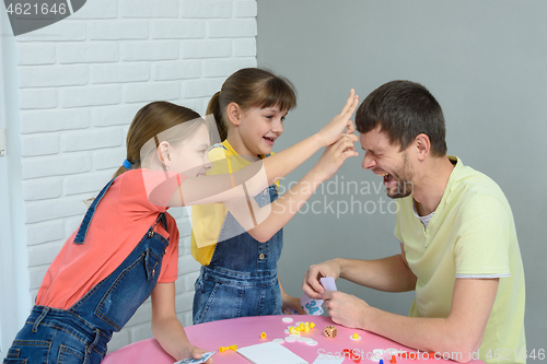 Image of Children beat dad scribble for losing the game