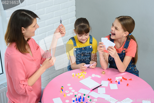 Image of Mom makes another move playing a board game