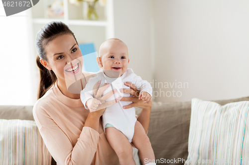 Image of happy mother with little baby boy at home