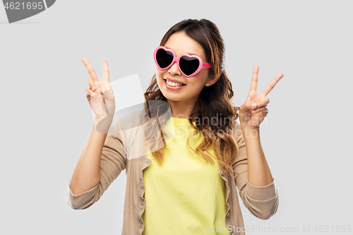 Image of asian woman in heart-shaped sunglasses