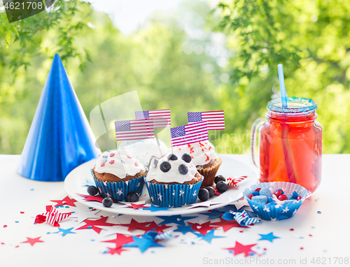 Image of cupcakes with american flags on independence day