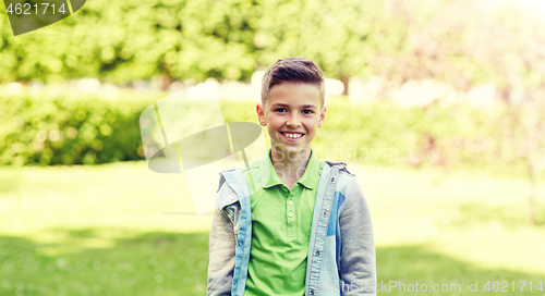 Image of happy smiling boy at summer park