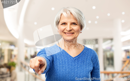 Image of senior woman pointing finger to you