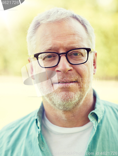 Image of close up of senior man in glasses outdoors