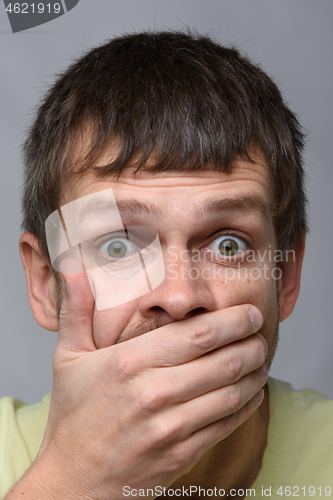 Image of Close-up portrait of a man of European appearance, depicting a fright