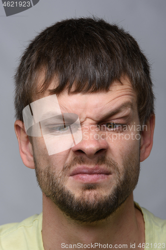 Image of Closeup portrait of a man looking at his nose, European appearance