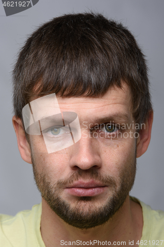 Image of Closeup portrait of an upset crying man of European appearance