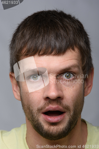 Image of Closeup portrait of astonished man of European appearance