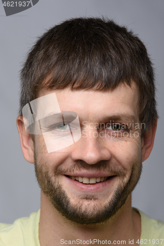 Image of The closeup portrait of a happy man