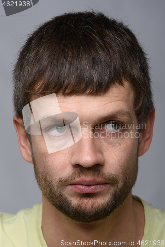 Image of Portrait of a pensive man of European appearance looking away, close-up