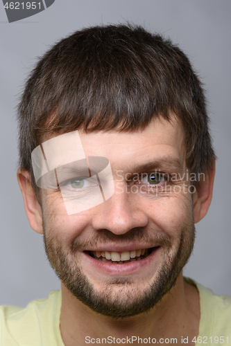 Image of The closeup portrait of a smiling man