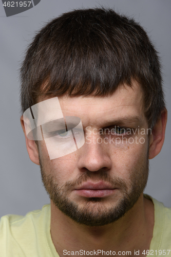 Image of Close-up portrait of a very upset man of European appearance