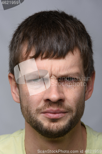 Image of Closeup portrait of an anxious man of European appearance