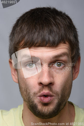 Image of Close-up portrait of a very startled man of European appearance