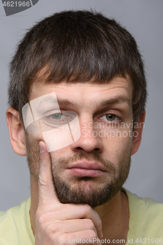 Image of Closeup portrait of a sad and pensive man of European appearance