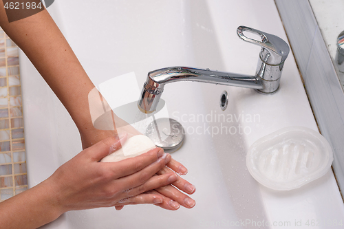 Image of Girl soaping her hands with a soap